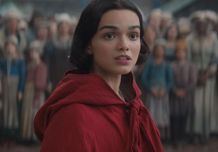 Rachel Zegler as Snow White with a red cloak